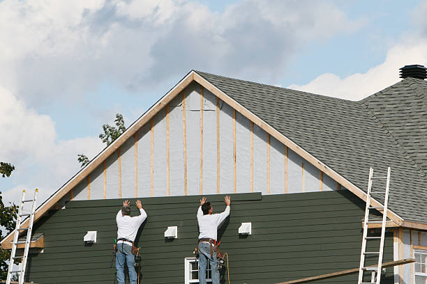 Professional Storm Damage Siding Repair technician working in Mason, OH